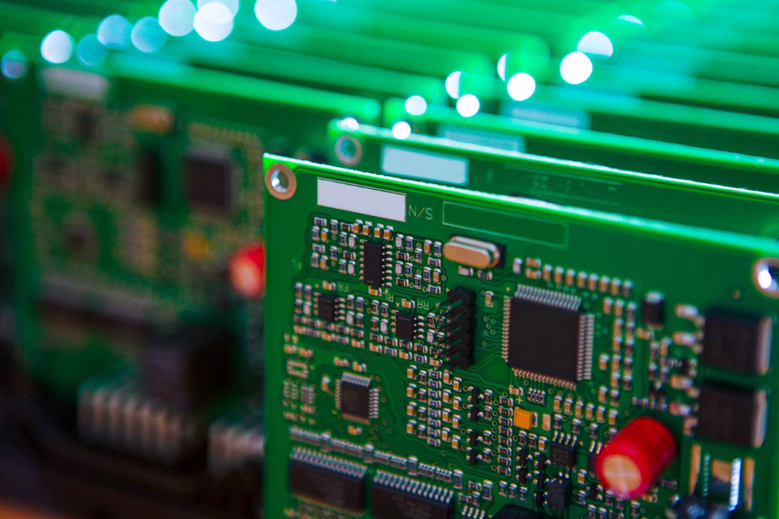 Close-up of multiple printed circuit boards featuring surface mount components