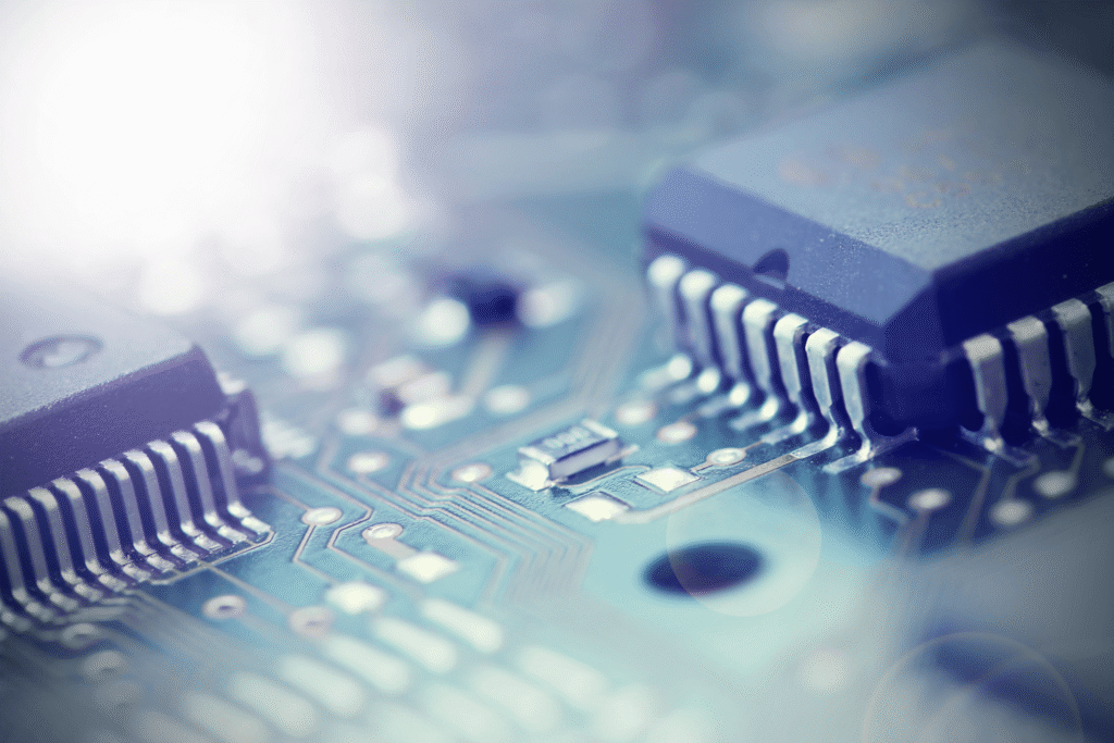 Close-up of a circuit board featuring surface mount ICs